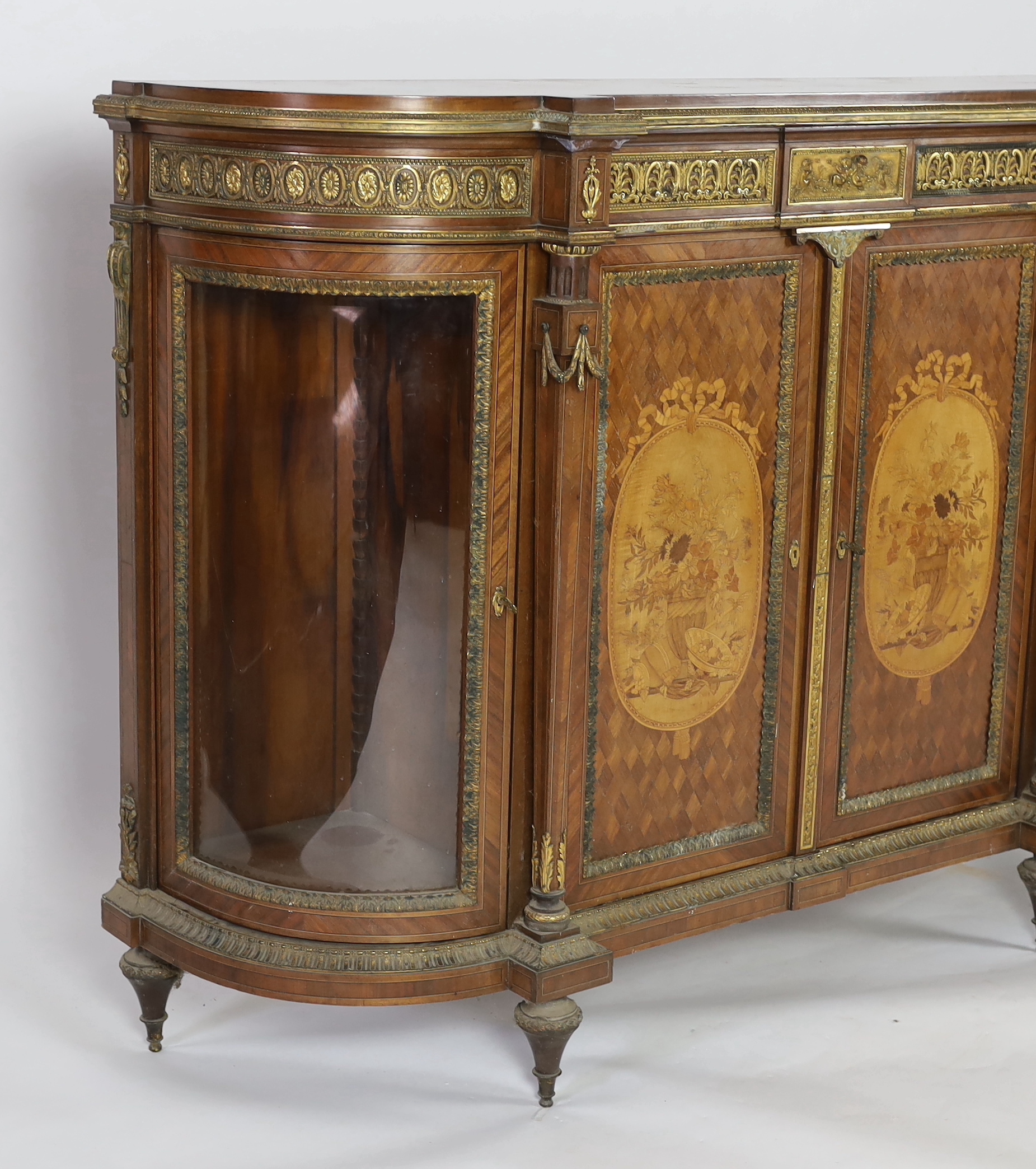 A late 19th century French Louis XVI style inlaid mahogany and ormolu mounted credenza